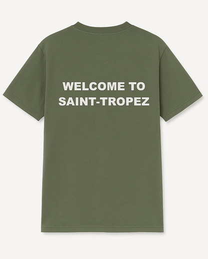 Green t-shirt with 'Welcome to Saint-Tropez' text on the back against a white background